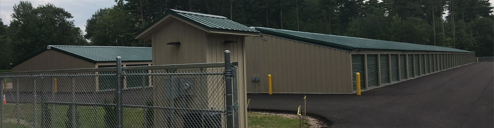 row of storage units with fence